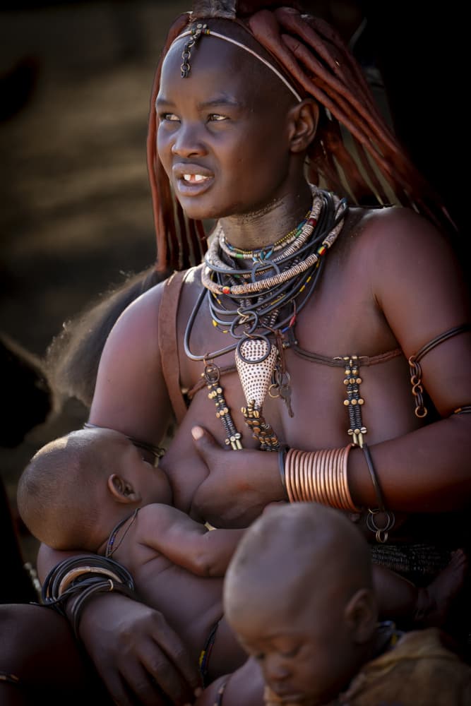 Himba Mother Nurturing Child by Eyal Alcalay — canvas wall art