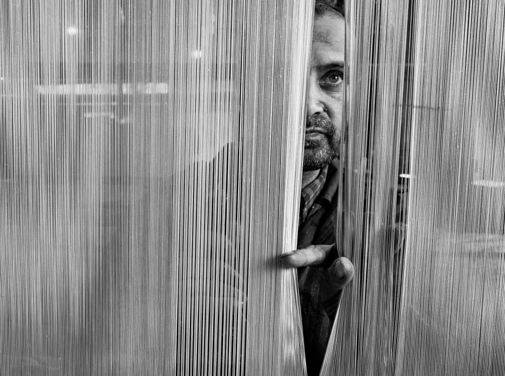 Man Peering Through Threads by Jassi Oberai — canvas wall art