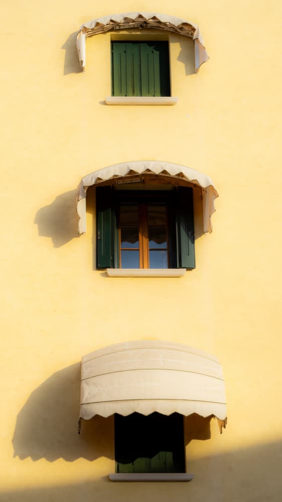 Green Shutters Yellow Wall by Tamami yoshida — canvas wall art