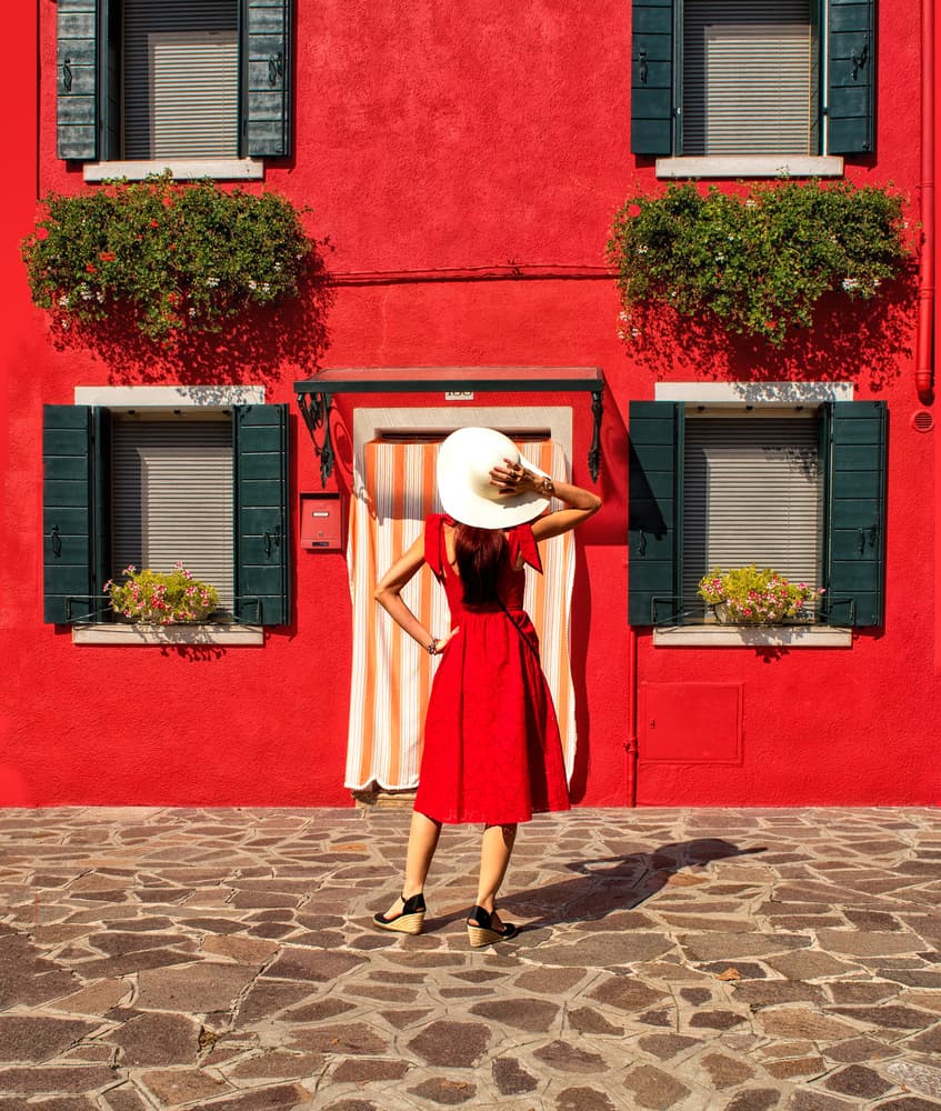 Red Dress On Burano Street by Anette Ohlendorf — canvas wall art