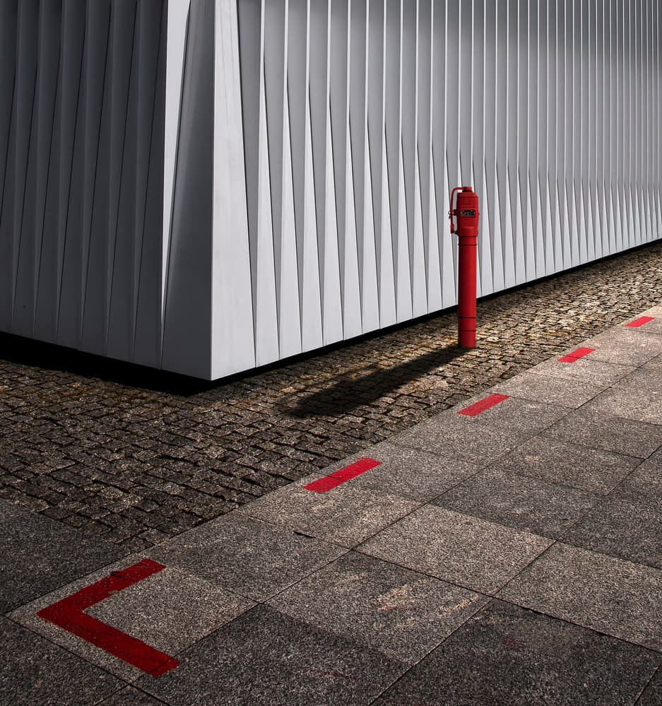 White Building Red Hydrant by Tomasz Buczkowski ( Tomush ) — canvas wall art
