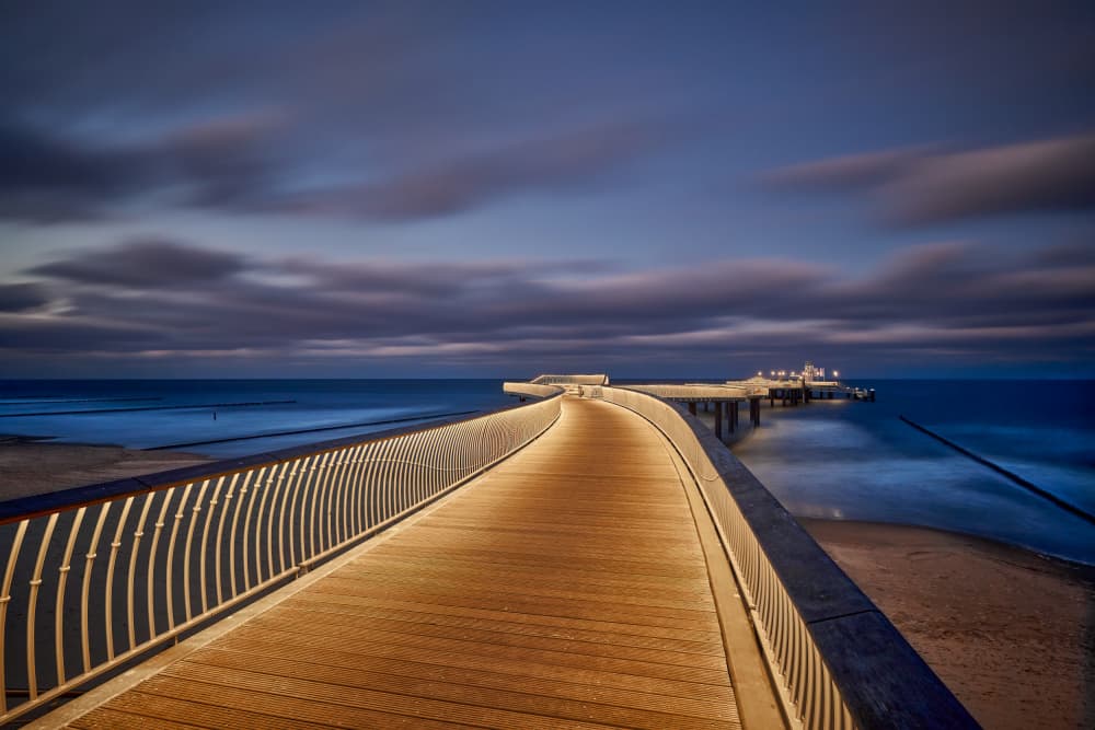 Illuminated Ocean Pier by Radek Pohnan — canvas wall art