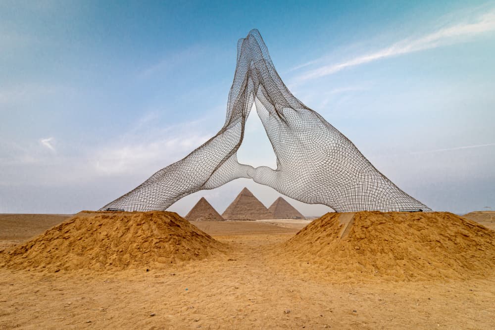 Wire Hands Pyramids by Ahmed Kassem — canvas wall art