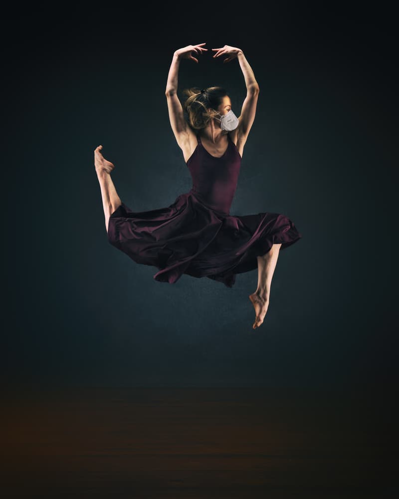 Graceful Masked Dancer Leaping by Rob Li — canvas wall art