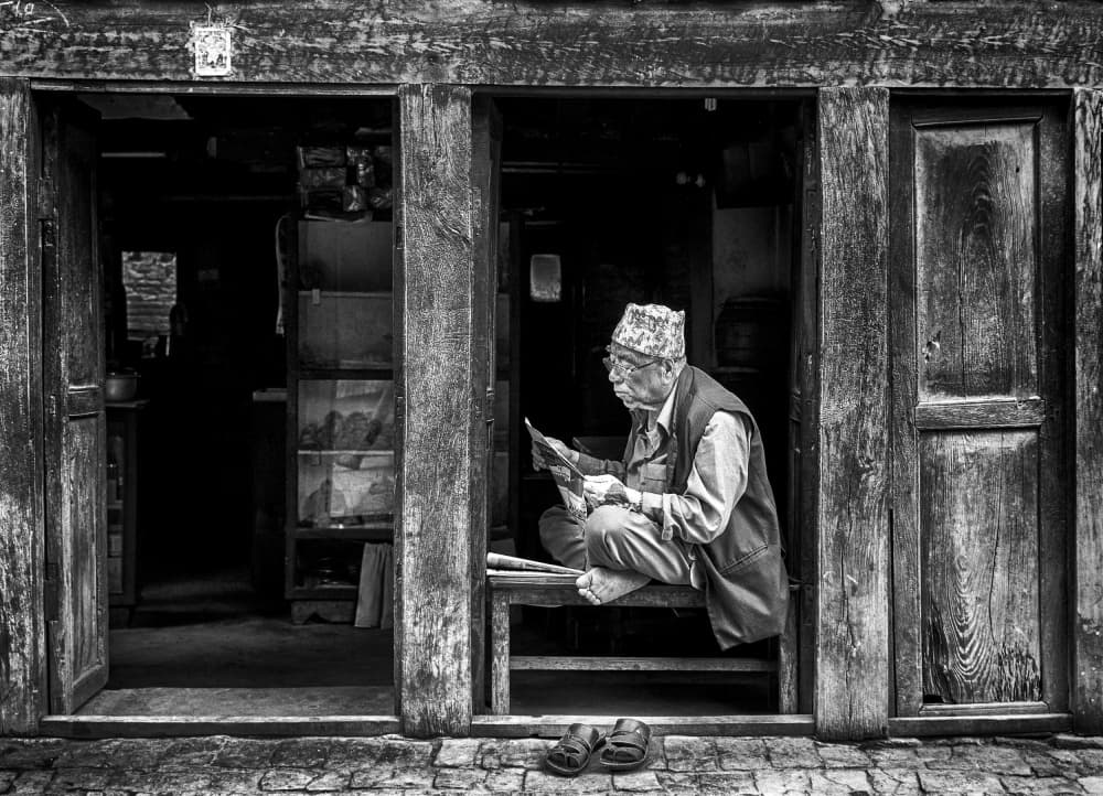 Old Man Reading Doorway by Angela Muliani Hartojo — canvas wall art