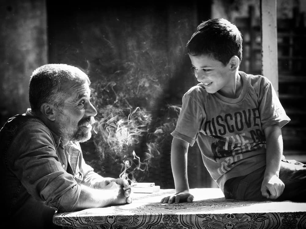 Man Boy Shared Conversation by Gilcan Mete — canvas wall art