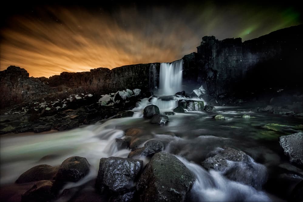 Aurora Over Night Waterfall by Chris Coenders — canvas wall art
