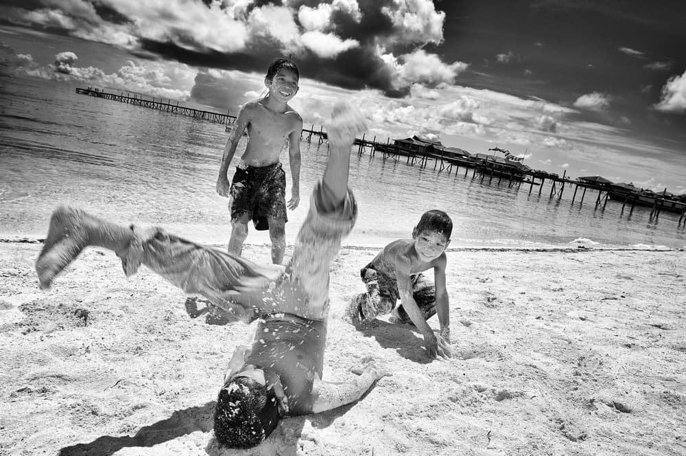 Energetic Beach Play by Martin Froyda — canvas wall art