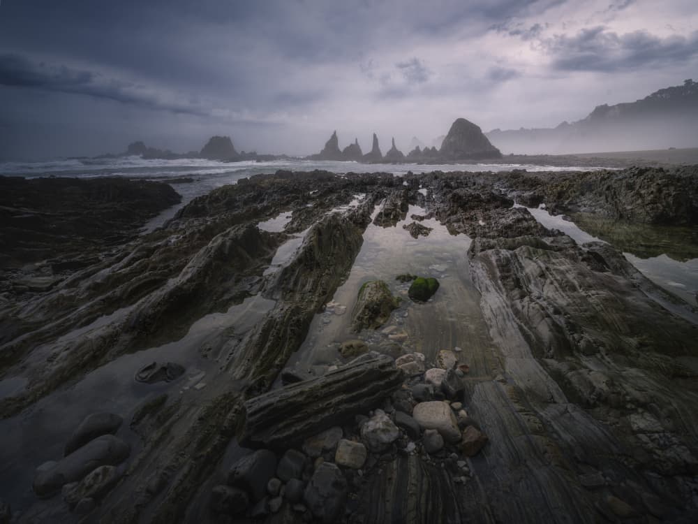 Dark Coastal Sea Stacks by Josema Martin Espinar — canvas wall art