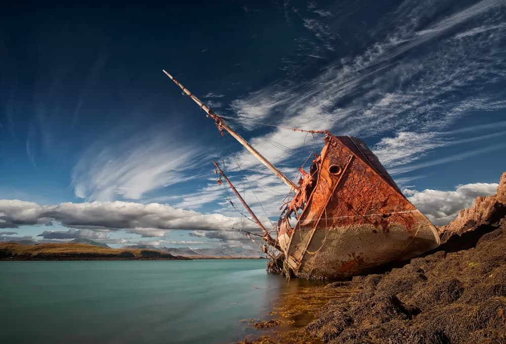 Rusty Shipwreck Shoreline by Þorsteinn H. Ingibergsson — canvas wall art