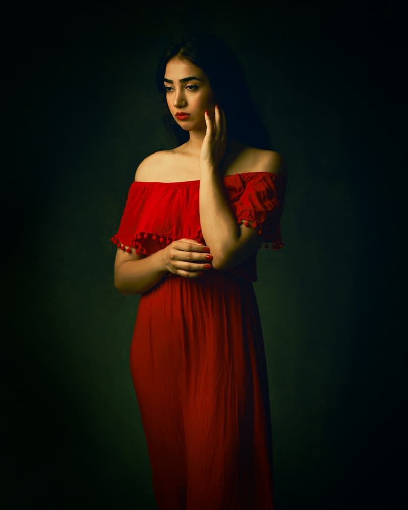 Pensive Woman In Red by Mehdi Mokhtari — canvas wall art