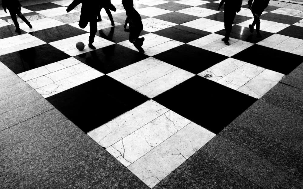 Kids Playing Checkered Floor by Arastoo Qadermazi — canvas wall art