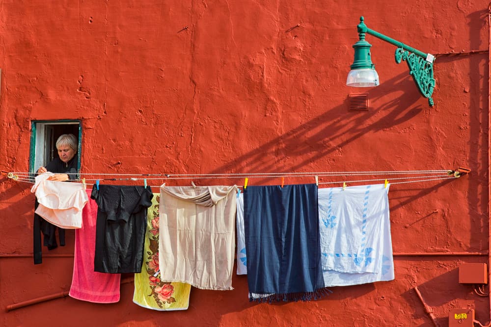 Red Wall Laundry by Benjamine Hullot Scalvenzi — canvas wall art