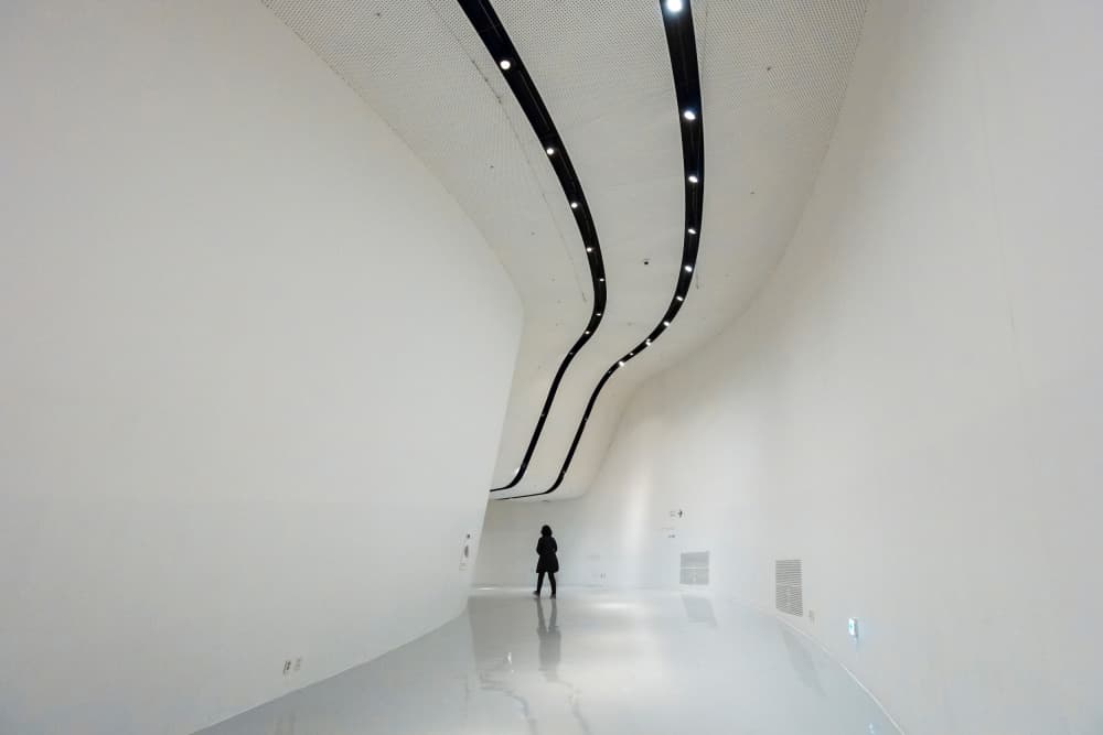 Lone Figure Modern White Hall by Shin Woo Ryu — canvas wall art