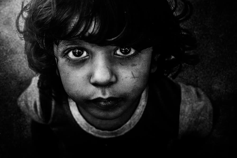 Intense Child Portrait by FATHI ALDARWISH — canvas wall art