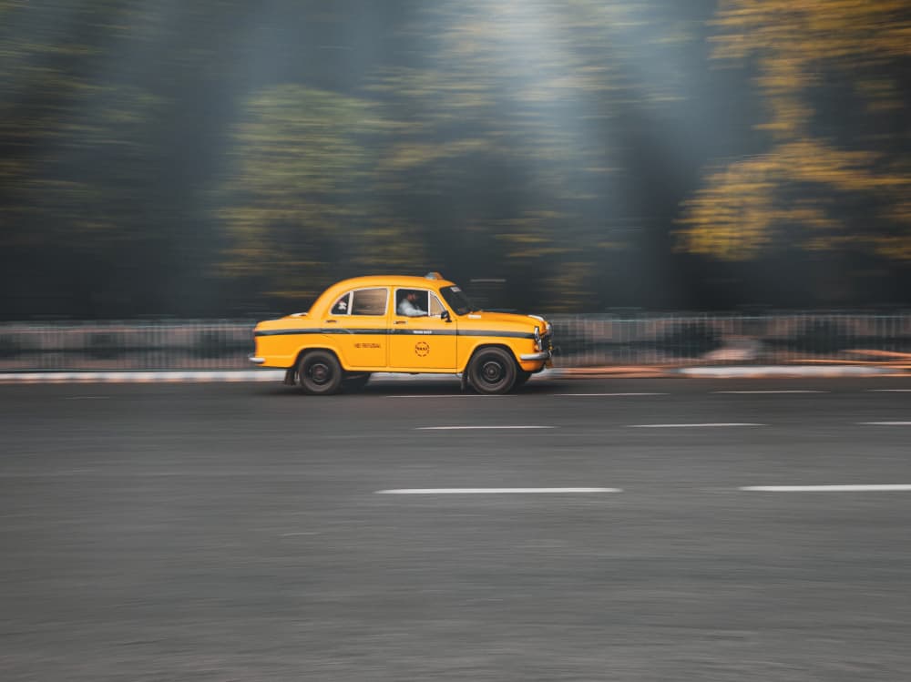 Speeding Yellow Taxi by Susnata Majumder — canvas wall art