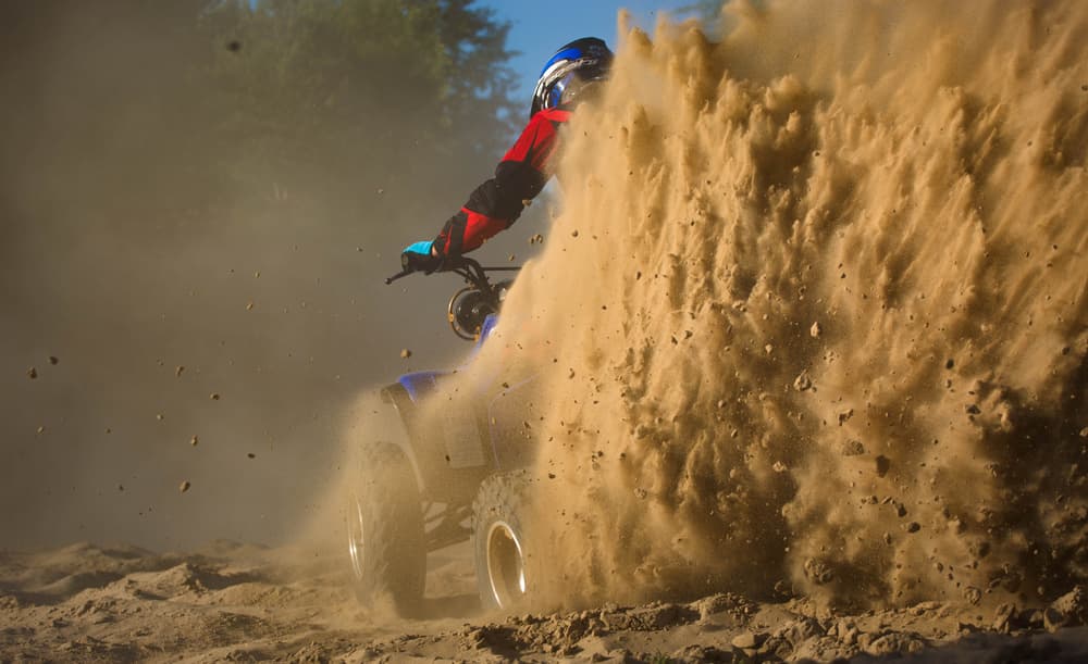 Quad Kicking Up Dust by Wojciech Łączkowski — canvas wall art