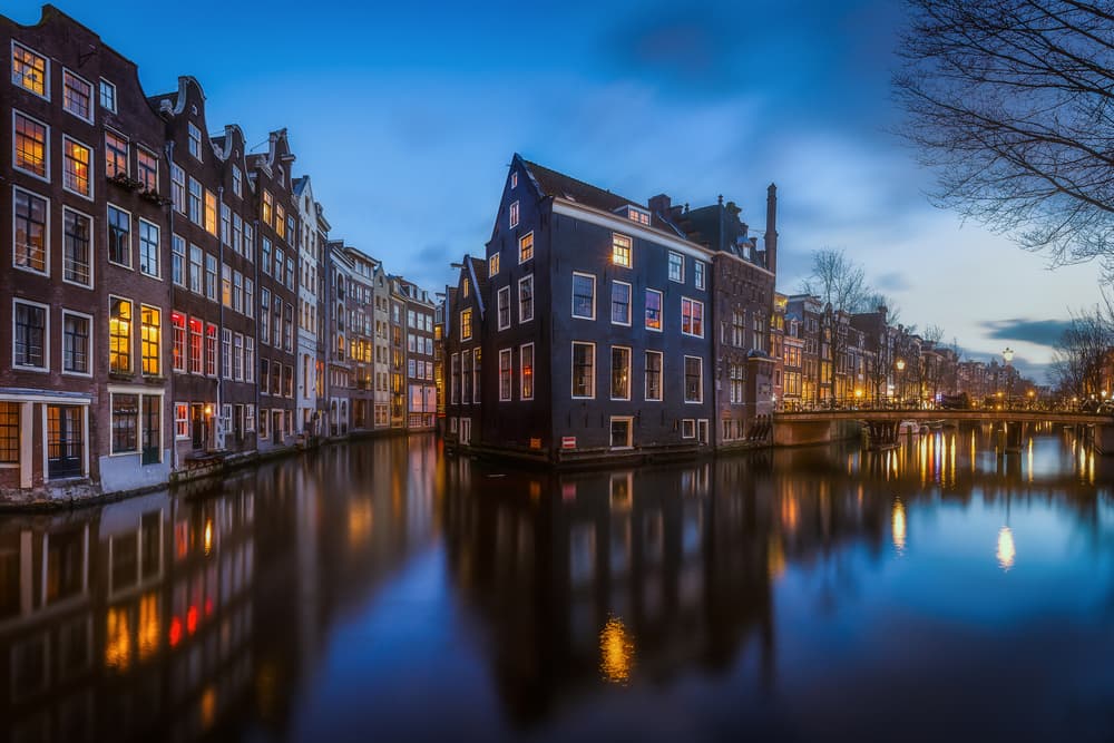 Amsterdam Canal Reflections by Clara Gamito — canvas wall art
