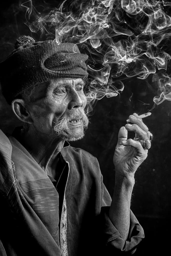 Elderly Man Smoking by Angela Muliani Hartojo — canvas wall art