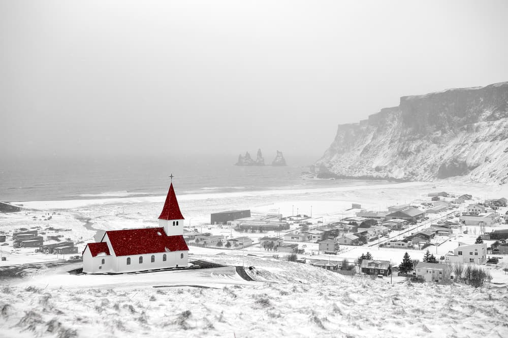 Snowy Red Roof Church by Eyal Amer — canvas wall art