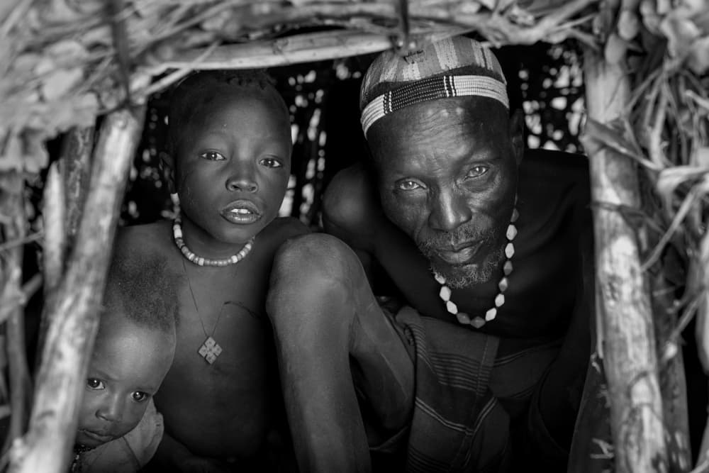 Indigenous Family Gaze by Mohammed Al Sulaili — canvas wall art