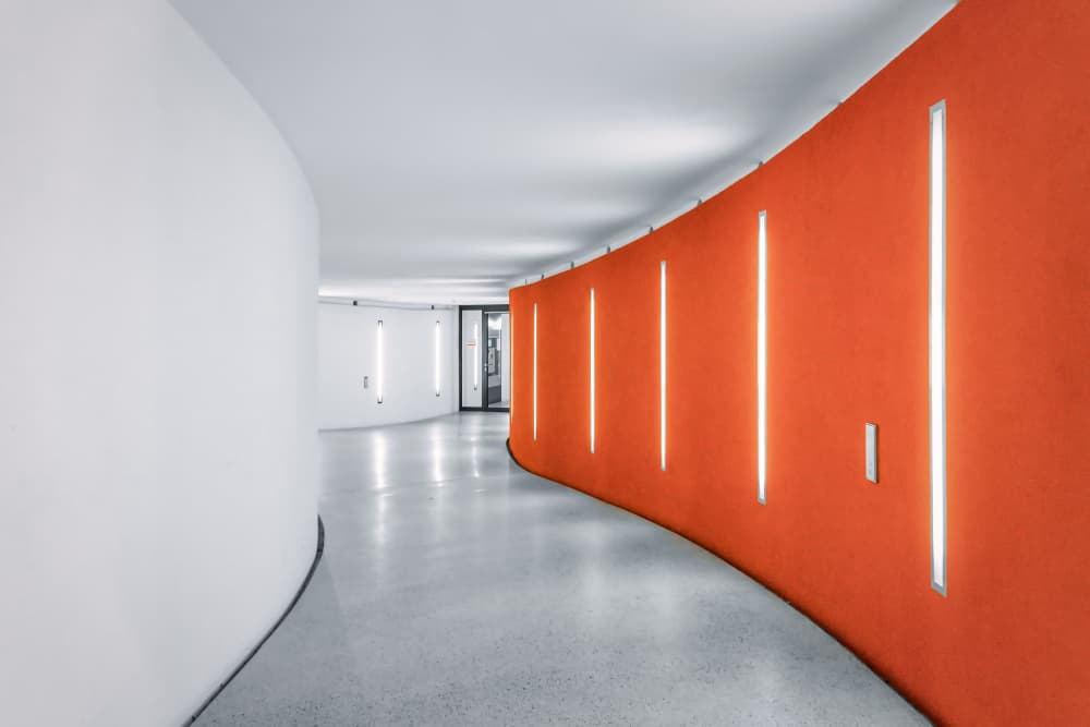 Orange Curved Hallway by Adam Dauria ☂ — canvas wall art