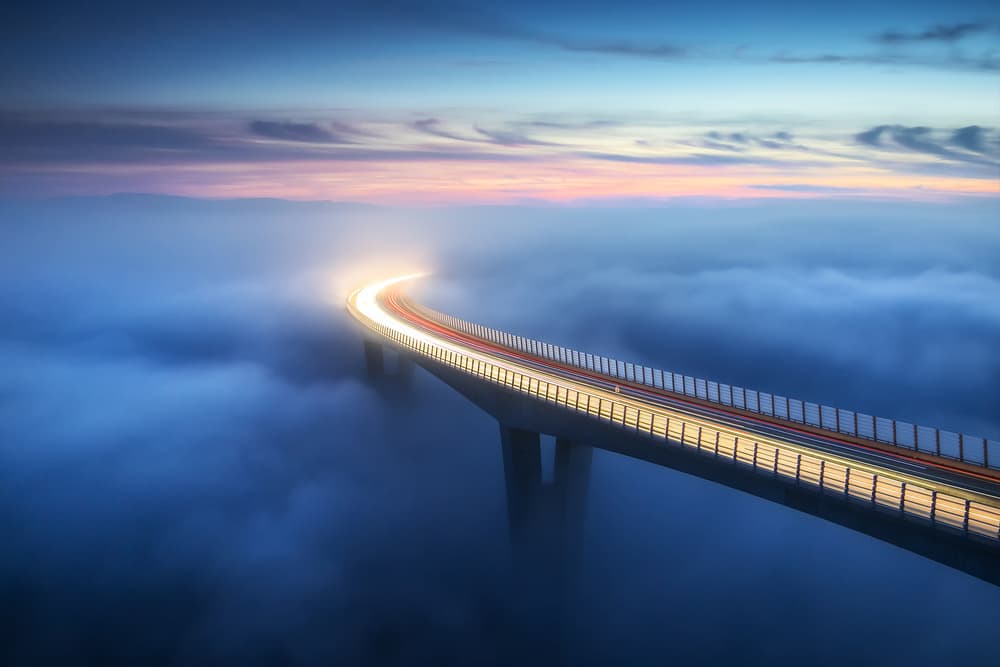 Glowing Foggy Bridge by Ales Komovec — canvas wall art