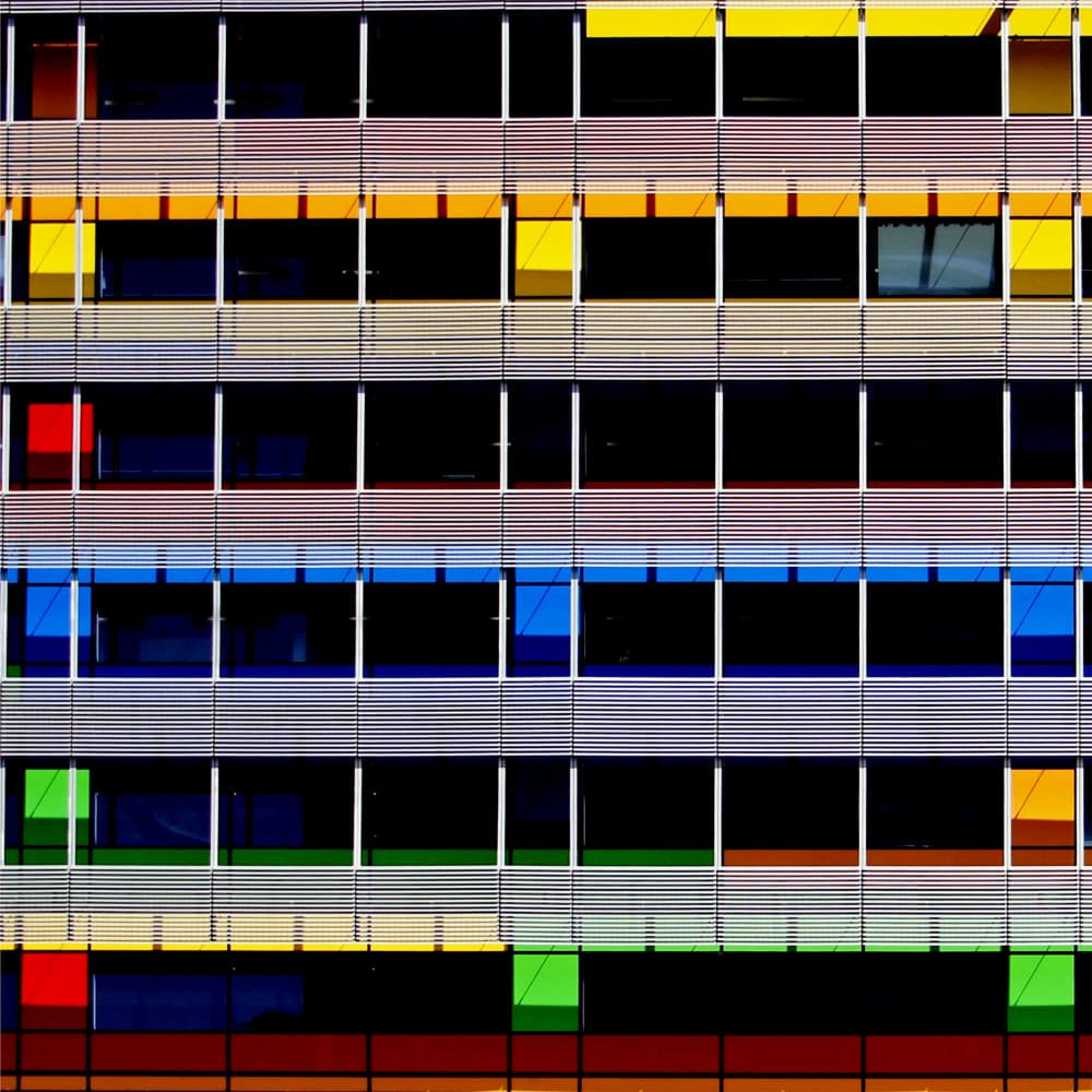 Colorful Building Facade by Aliza Riza — canvas wall art