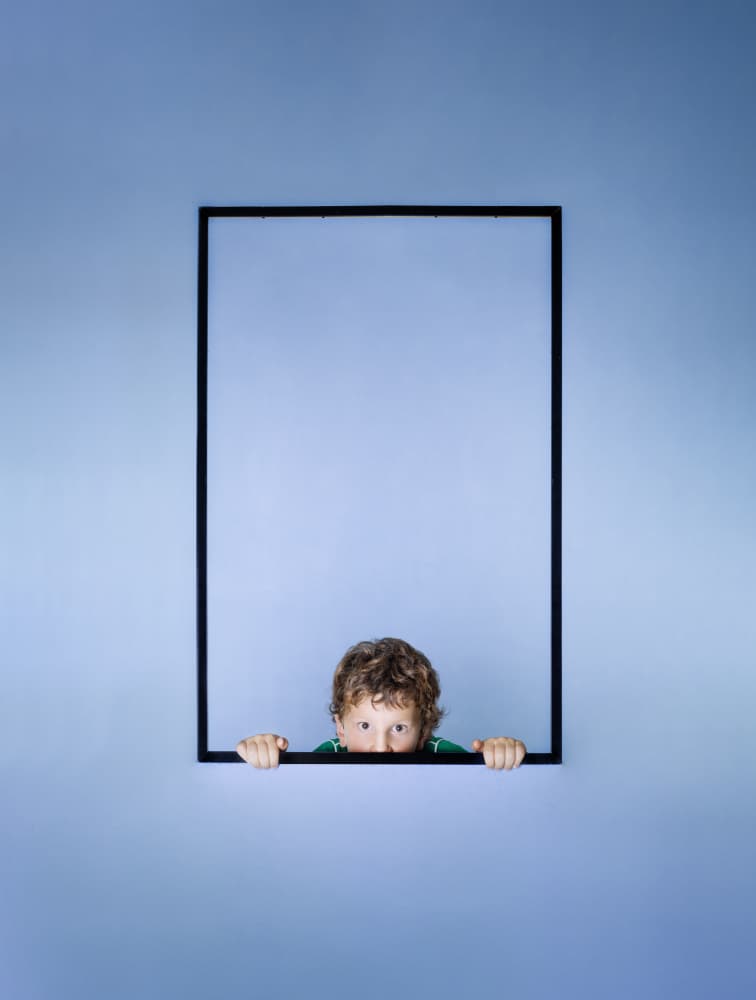 Curious Little Boy Peeking by Michael Allmaier — canvas wall art