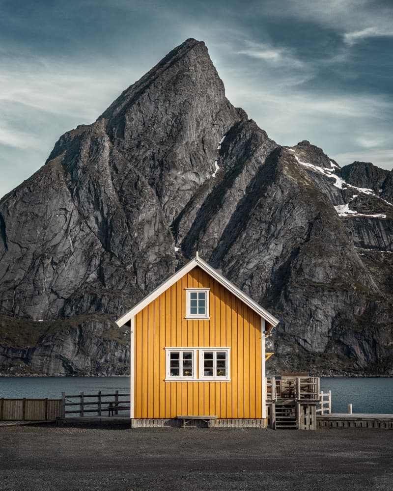 Yellow House Dramatic Fjord by Petri Damstén — canvas wall art