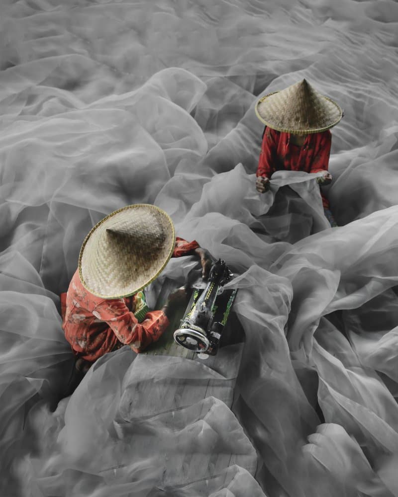 Fabric Workers in Red by Gatot Herliyanto — canvas wall art