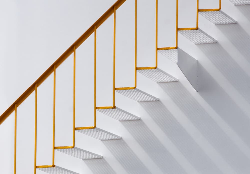 Yellow Railing Shadows by Jacqueline Hammer — canvas wall art