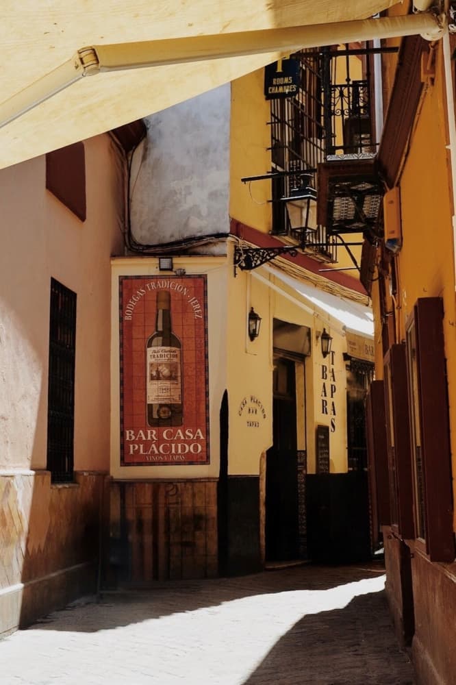 Sunny Spanish Alley Bar by Del Mundo Imagery — canvas wall art