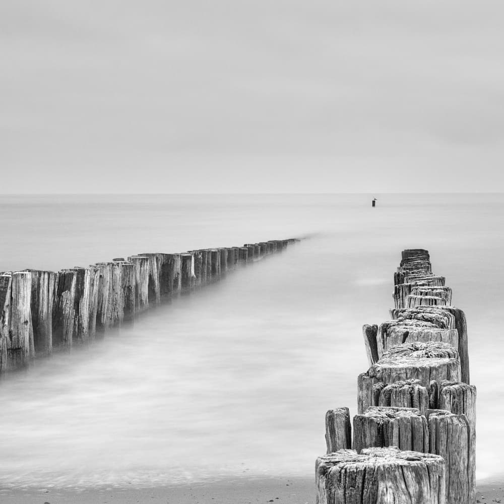Misty Sea Groynes by Michelle Degryse — canvas wall art