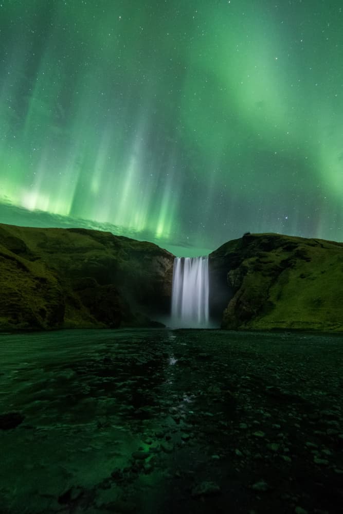 Majestic Aurora Waterfall by Kristvin Gudmundsson — canvas wall art