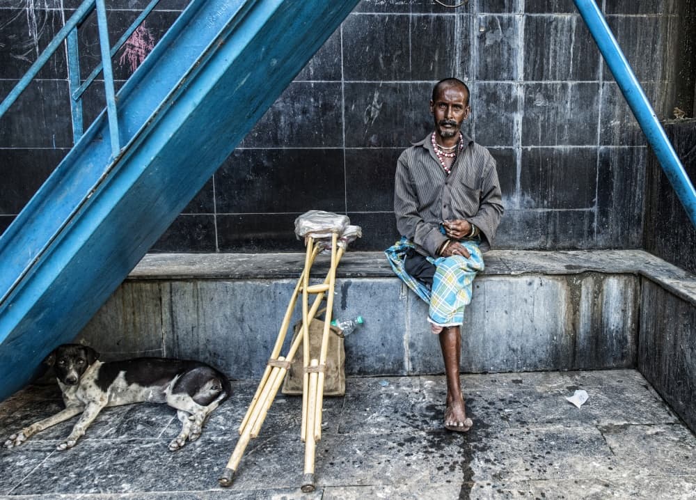 Indian Man Dog Crutches by Joxe Inazio Kuesta Garmendia — canvas wall art