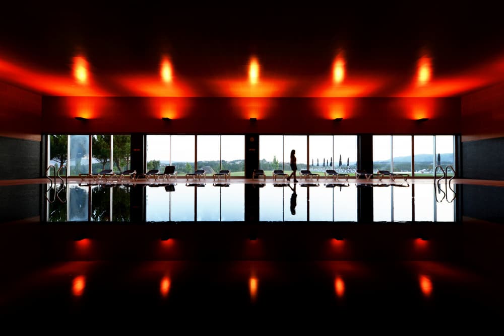 Woman By Redlit Pool by Jorge Pimenta — canvas wall art