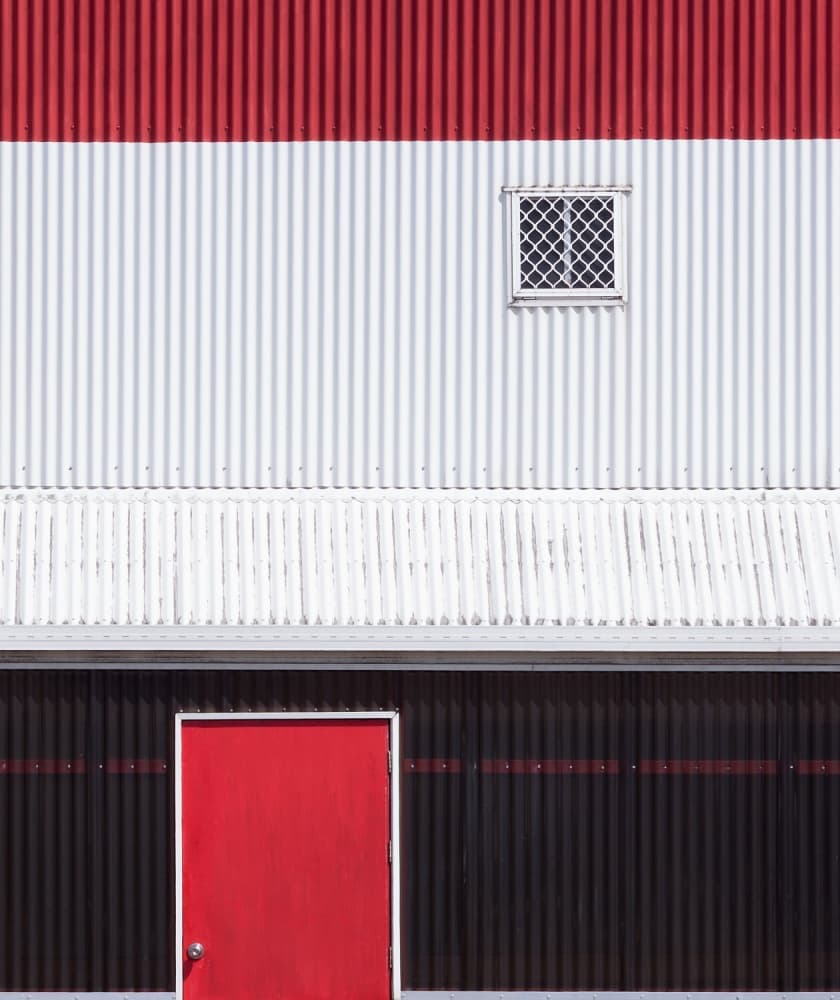 Modern Red Door Building by Jacqueline Hammer — canvas wall art
