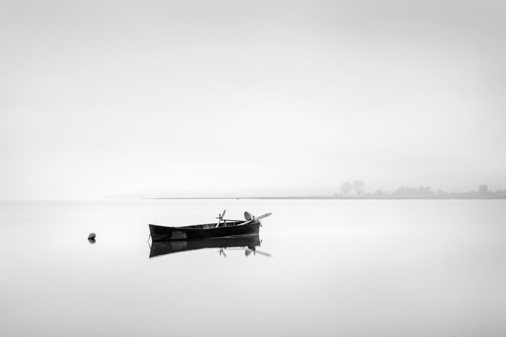 Serene Boat Reflection by George Digalakis — canvas wall art