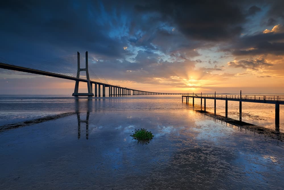 Long Bridge Sunset Reflections by Carlos Resende — canvas wall art