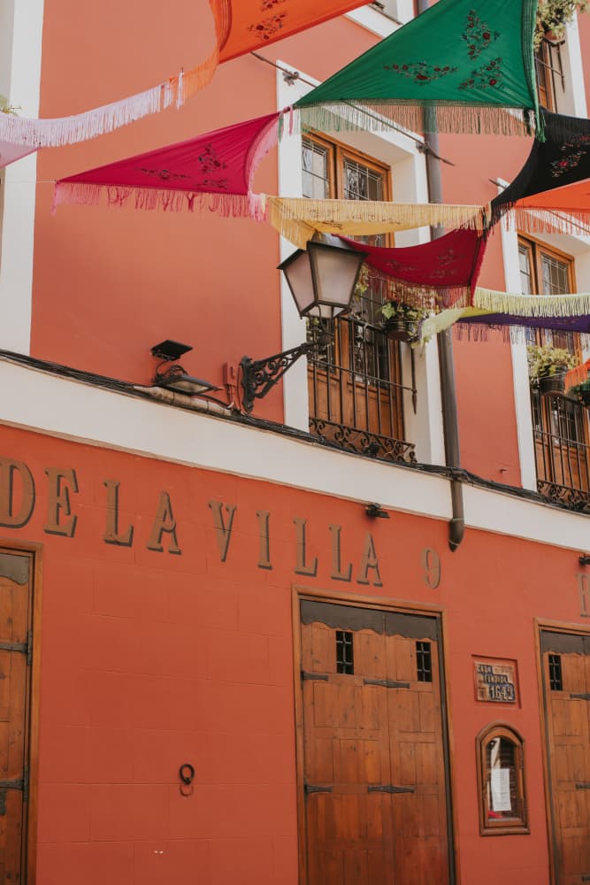 Vibrant Old Town Flags by Claudia Casal — canvas wall art