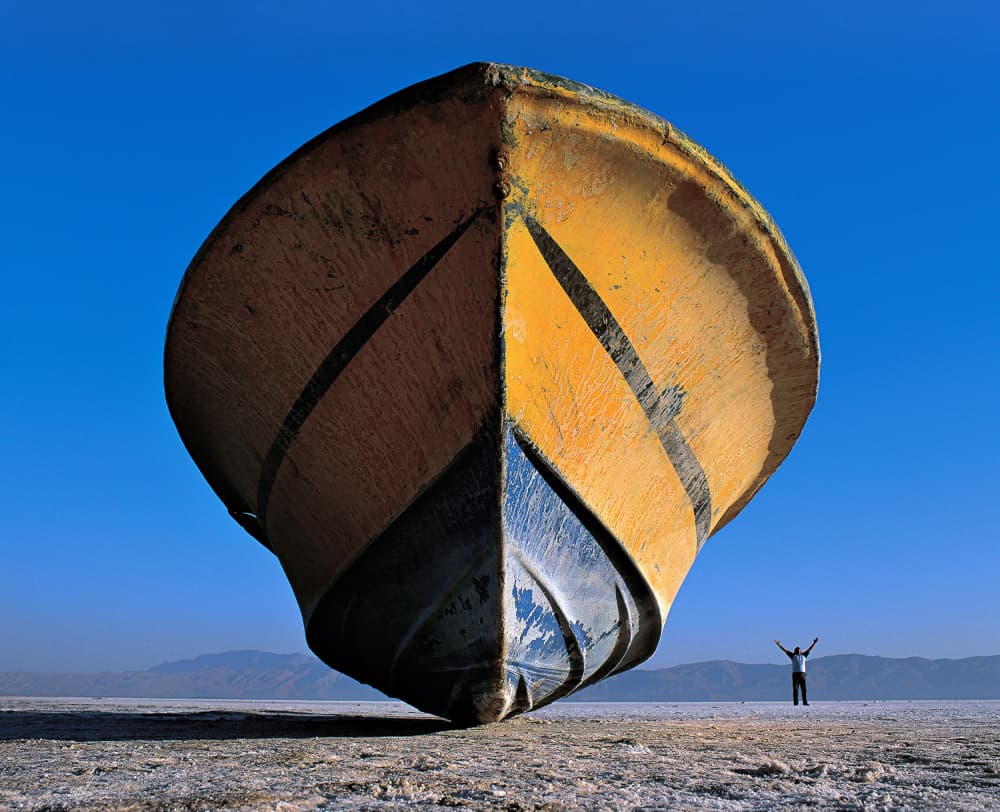 Stranded Boat And Man by Abbas Arabzadeh — canvas wall art