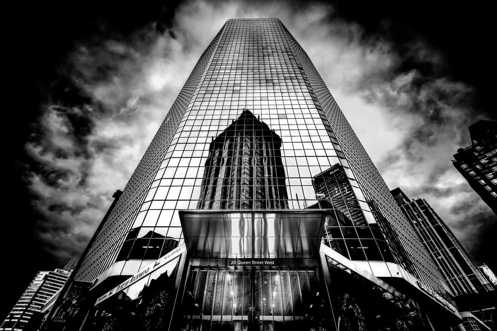 Dramatic Skyscraper Reflection by Jackson Carvalho — canvas wall art