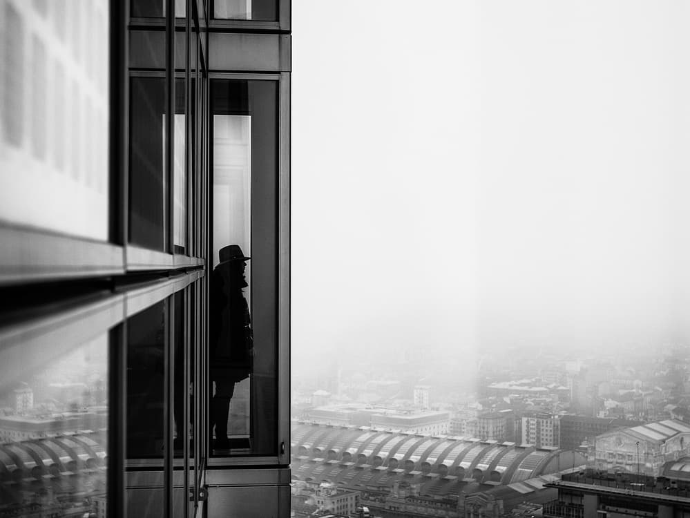 Man in Foggy City by Pristine Clothes — canvas wall art