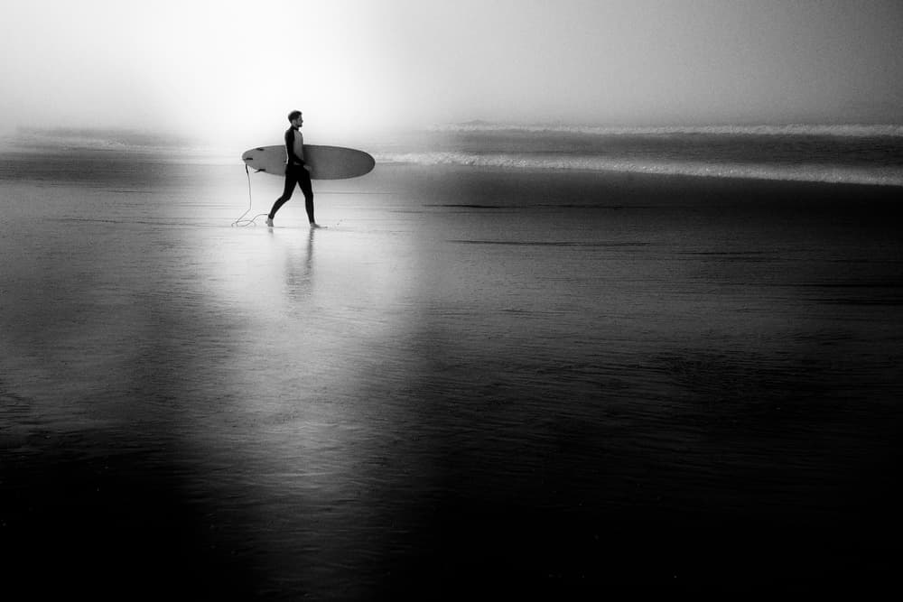 Misty Beach Surfer by Olavo Azevedo — canvas wall art