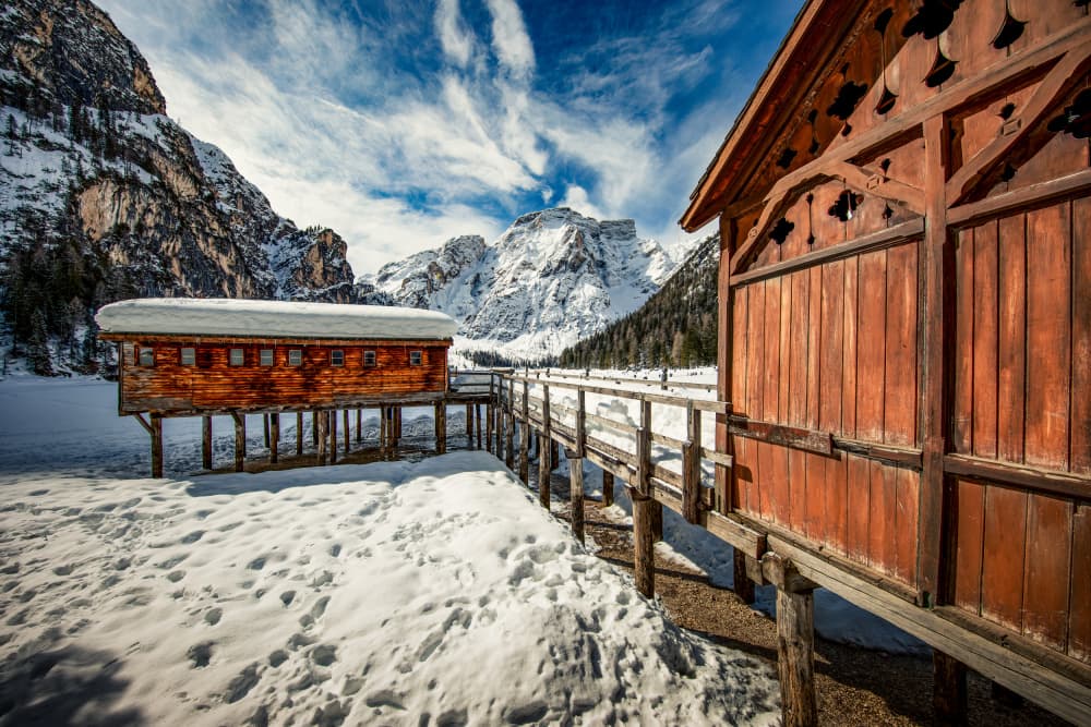 Snowy Alpine Lake Cabins by Marco Tagliarino — canvas wall art