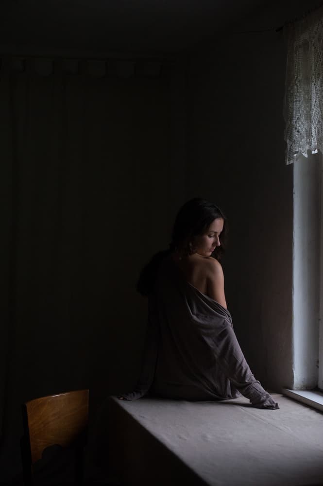 Pensive Woman by Window by Małgorzata Masarz — canvas wall art