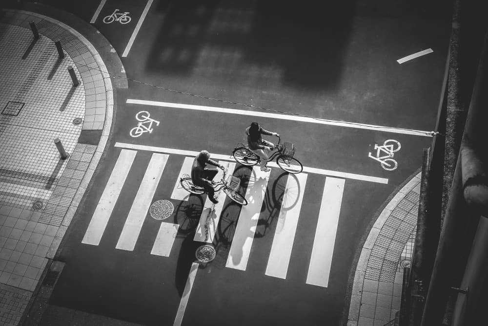 Urban Cyclists Crossing by Haruyo Sakamoto — canvas wall art