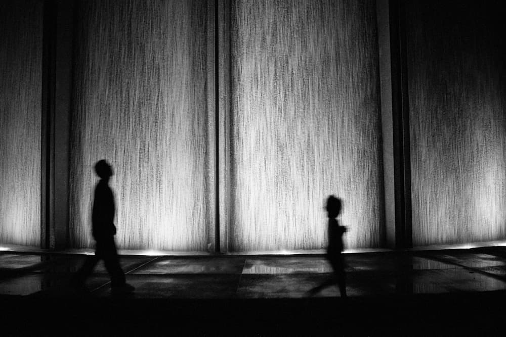Silhouettes at Water Wall by Michael Burlak — canvas wall art