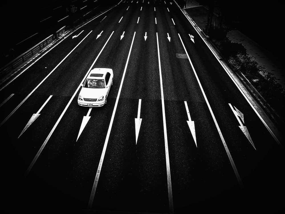 White Car Dark Highway by Masahiro Miyagi — canvas wall art